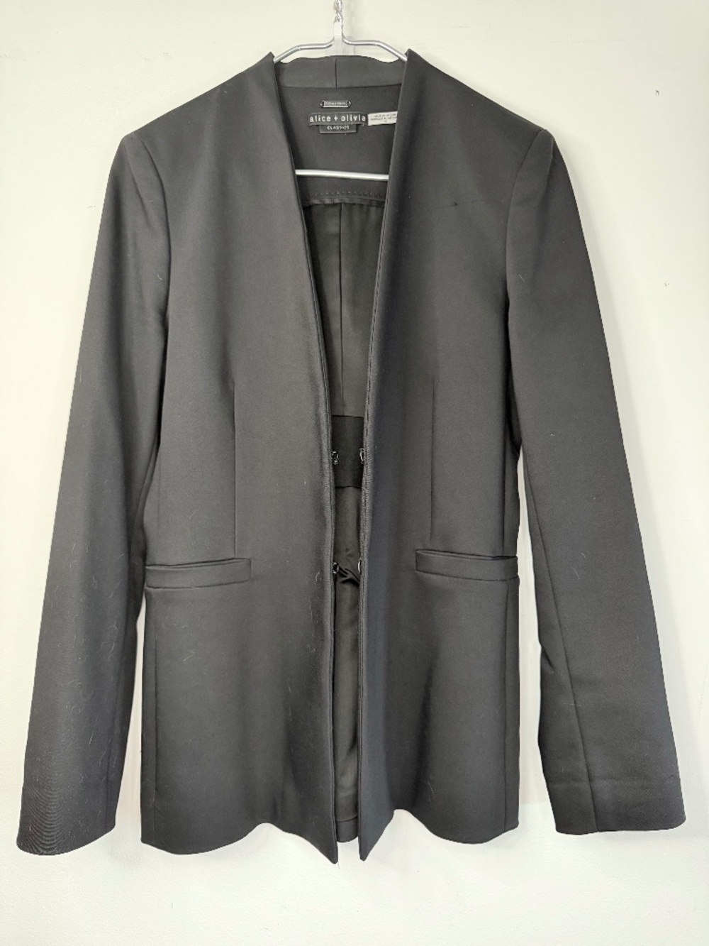Classic Alice + Olivia black blazer with a really clean, tailored silhouette.